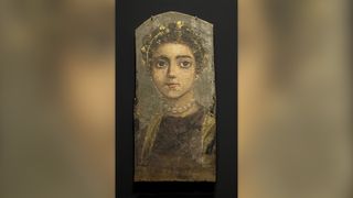 In this portrait, painted on wood between A.D. 120 and 130, we see a young girl wearing a pearl necklace and a golden wreath in her hair.
