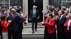 British Prime Minister Keir Starmer steps out of 10 Downing Street to greet Scottish MPs