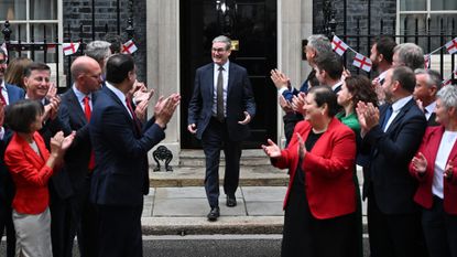 British Prime Minister Keir Starmer steps out of 10 Downing Street to greet Scottish MPs