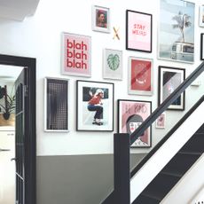 A gallery wall on a staircase wall
