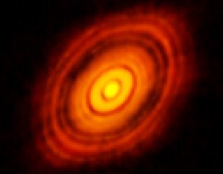 The ALMA telescopes in Chile captured this picture of disks that formed around a young star about 450 light years away from our planet. Now, scientists are proposing that similar disks could have formed around our sun in the early solar system, creating the seeds for our planets.