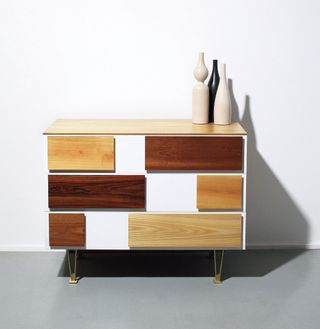 Image of a brown and white wooden chest of drawers