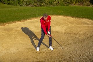 How the right hand works during a greenside bunker shot