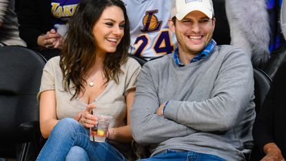 Smile, People, Cap, Denim, Sitting, Happy, Facial expression, Interaction, Sharing, Baseball cap, 