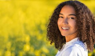 A woman smiling peacefully.