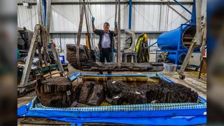 Ian Panter, head of conservation at York Archaeological Trust, examines the Bronze Age coffin.