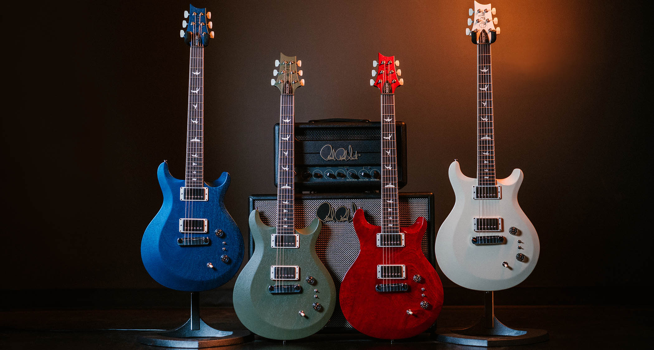 PRS S2 Mira 594: lined up against a PRS head and cab, the relaunched and refreshed Mira 594 is presented in blue, Matcha Green, red and Antique White