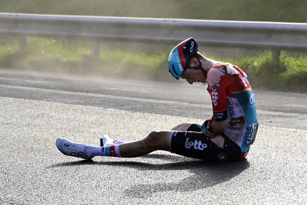 Lotto Dstny's Belgian rider Liam Slock reacts after falling during the 'Classic Brugge-De Panne' men's elite one-day cycling race, 198,9 km from Bruges to De Panne, on March 20, 2024. (Photo by LAURIE DIEFFEMBACQ / Belga / AFP) / Belgium OUT