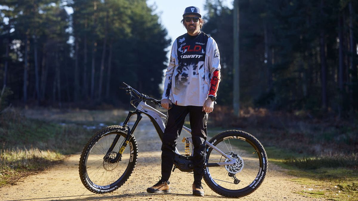 Rob Warner stands with his new Giant e-MTB