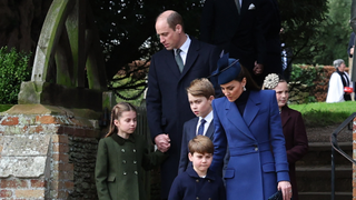 Revd Paul Williams (L) stands bay as Britain's Prince William, Prince of Wales (C) and Britain's Princess Charlotte of Wales (2L), Britain's Catherine, Princess of Wales (R) walks away from the church with Britain's Prince George of Wales and Britain's Prince Louis of Wales after attending the Royal Family's traditional Christmas Day service at St Mary Magdalene Church on the Sandringham Estate in eastern England, on December 25, 2023