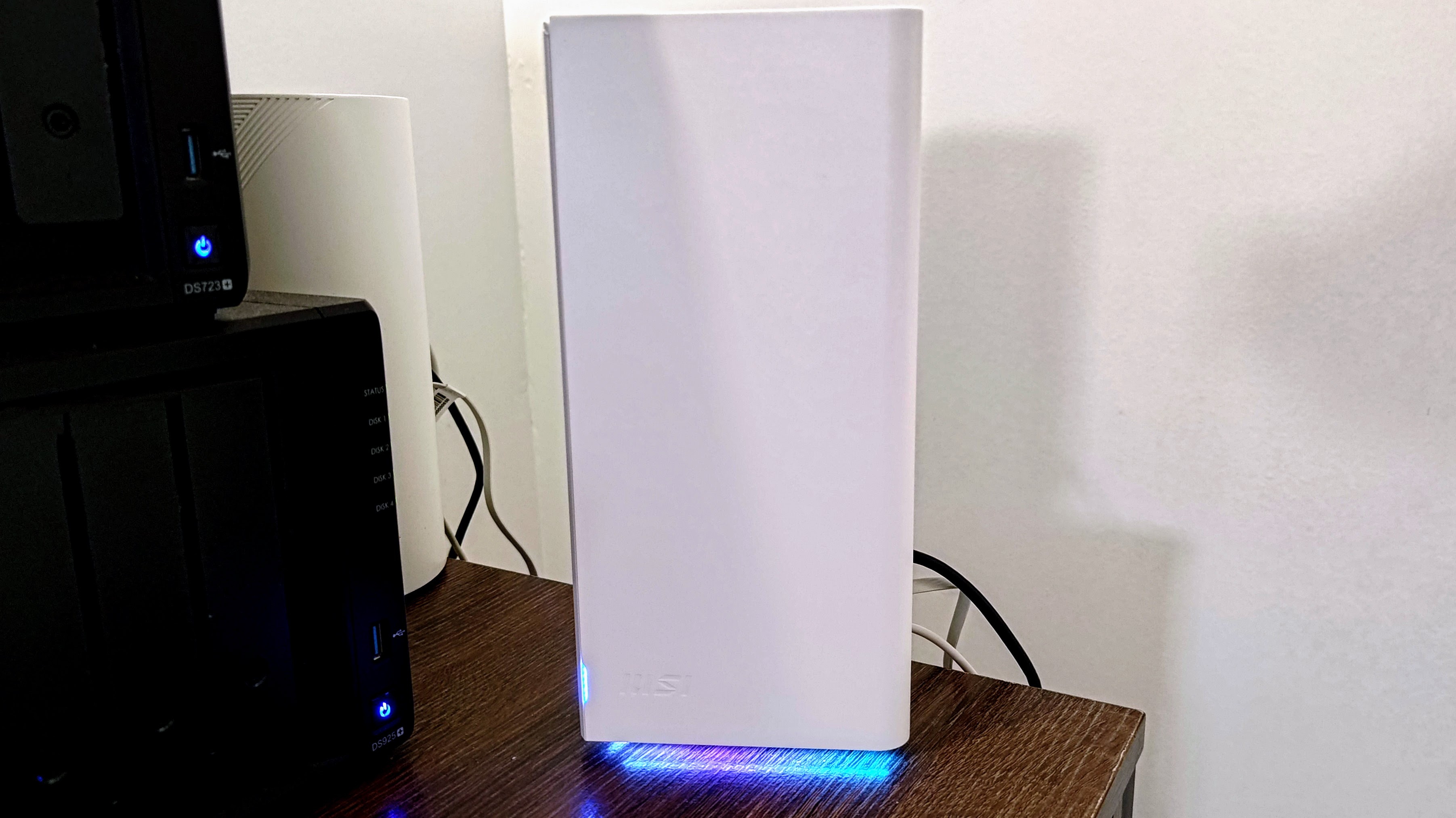 MSI Roamii BE Pro on a desk showing lights