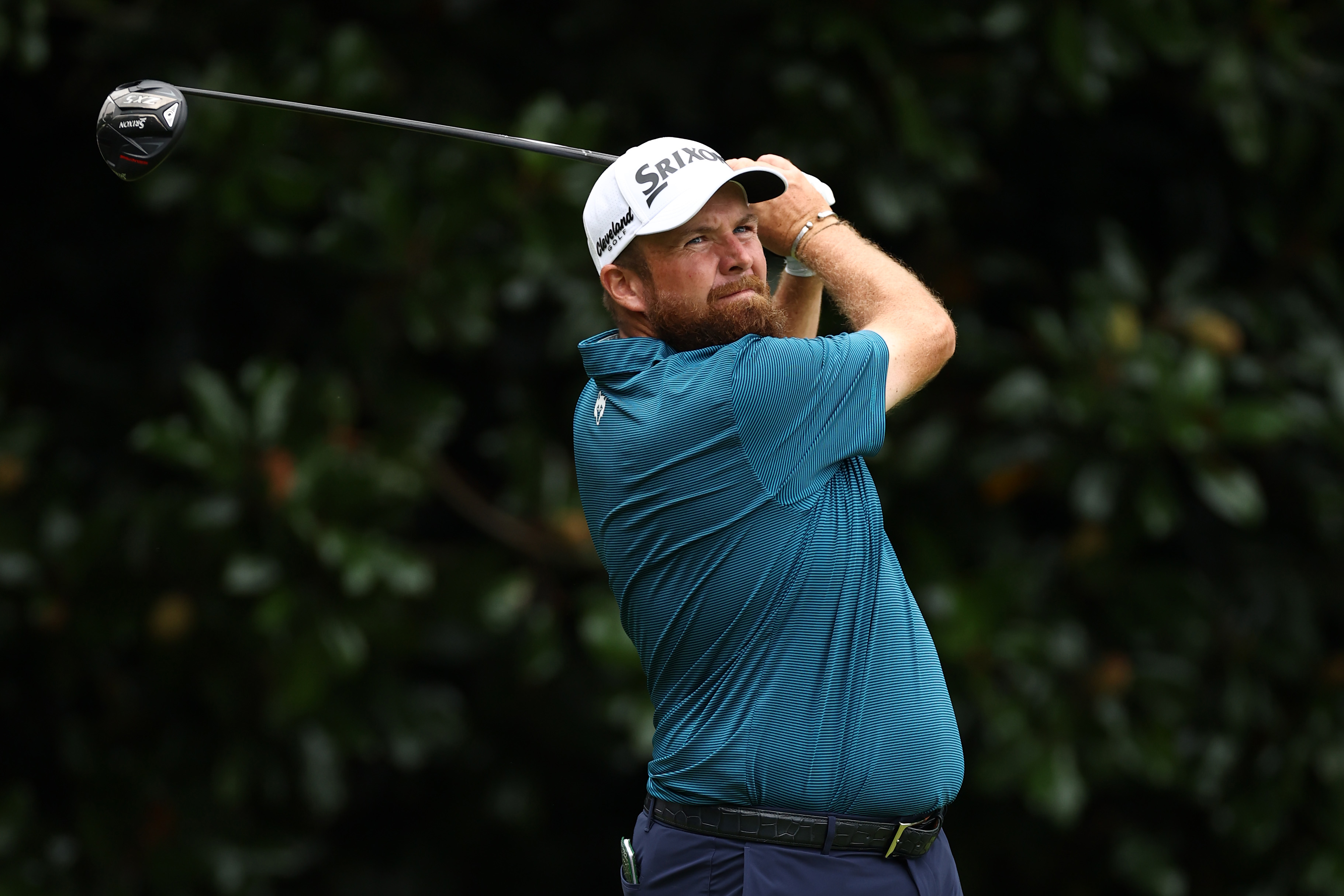 Shane Lowry hits a tee shot with a driver