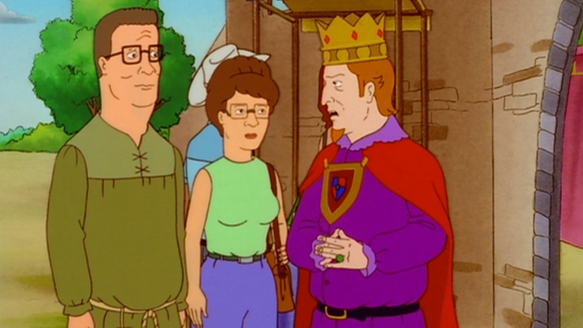 Hank Hill (Mike Judge), Peggy Hill (Kathy Najimy) and King Philip (Alan Rickman) at a renaissance faire