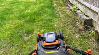 Worx WG743 POWER SHARE 40-Volt 17 in. Cordless Mower being tested in writer's home