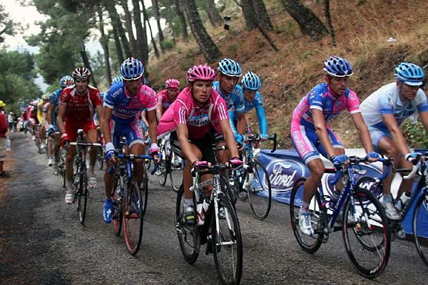 The rear group steadily make their way up the final climb of the day.