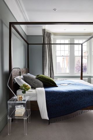 Grey bedroom with four poster bed
