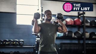 Muscular black man lifting dumbbells in the gym