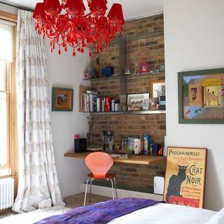 room with study desk and chair with bookshelves