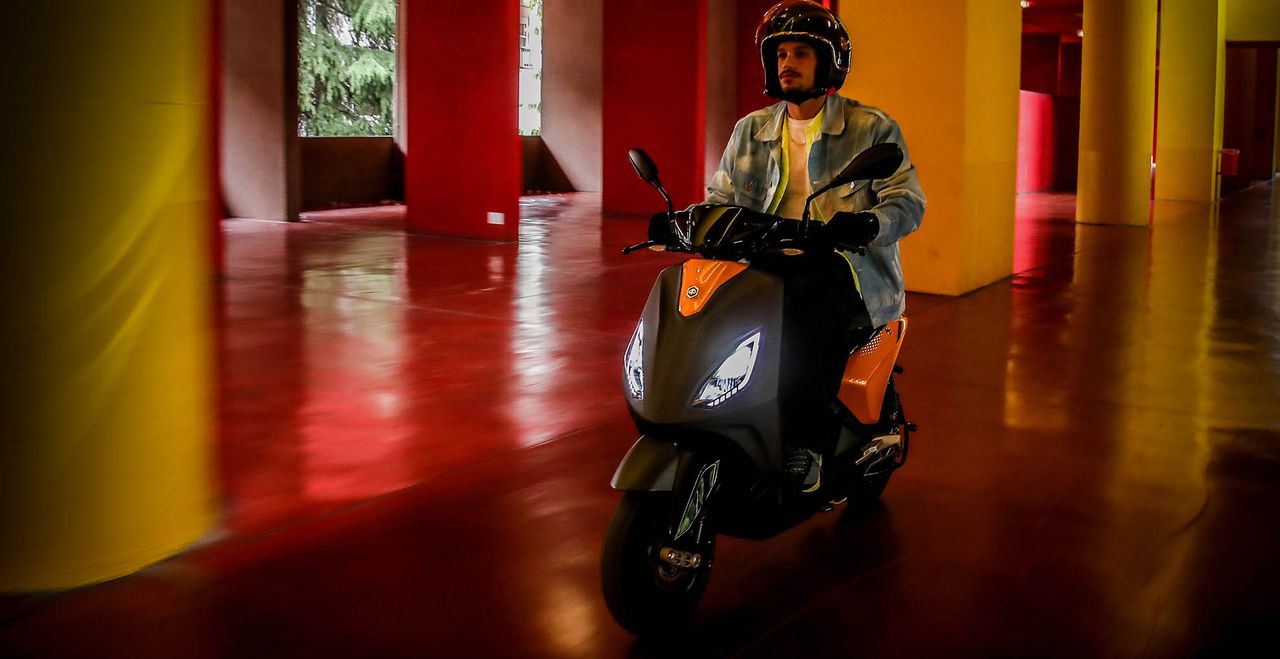 A man riding the new Piaggio 1 e-scooter