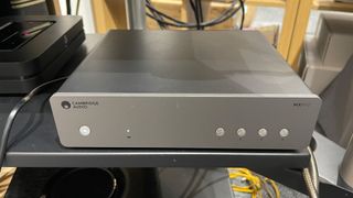Cambridge Audio MXN10 music streamer on a rack shelf