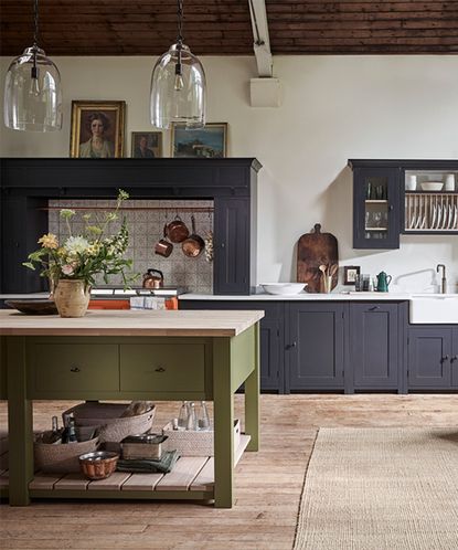 Severe Red Kitchen Has A Wooden Island And Several Cooking Appliances  Backgrounds