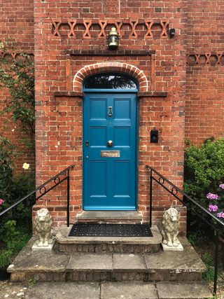 exterior of townhouse with blue gloss door