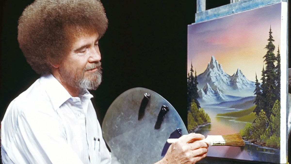 A photo of Bob Ross painting