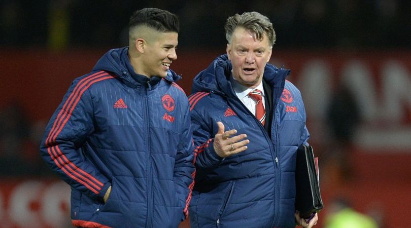 Louis van Gaal speaks to Marcos Rojo at Manchester United