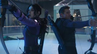 Kate Bishop (Hailee Steinfeld) and Clint Barton (Jeremy Renner) aim their bow-and-arrows in Hawkeye
