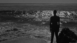 A man looking out to sea in I Walked With A Zombie (1943)