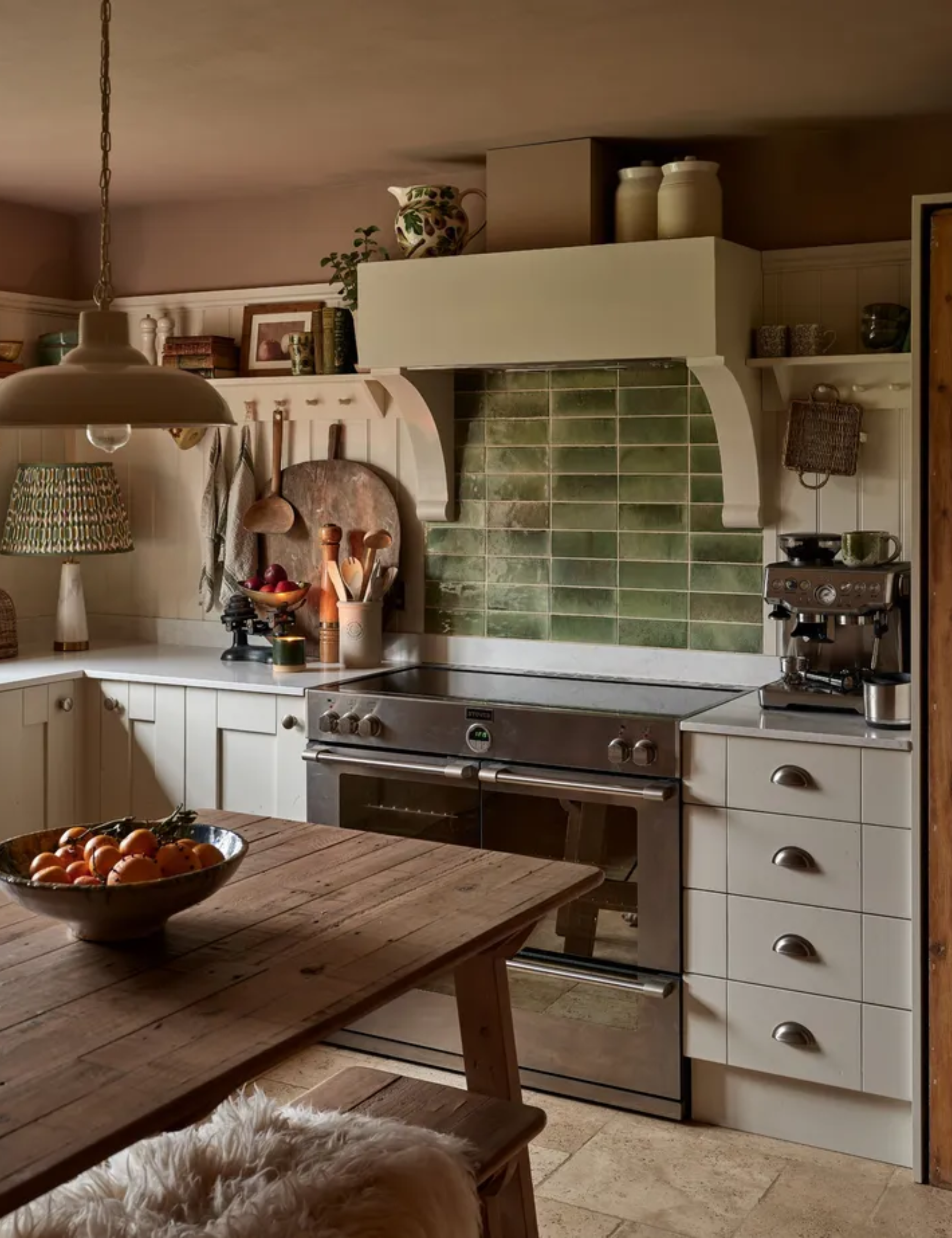 A cozy cottage kitchen with a green tile backsplash