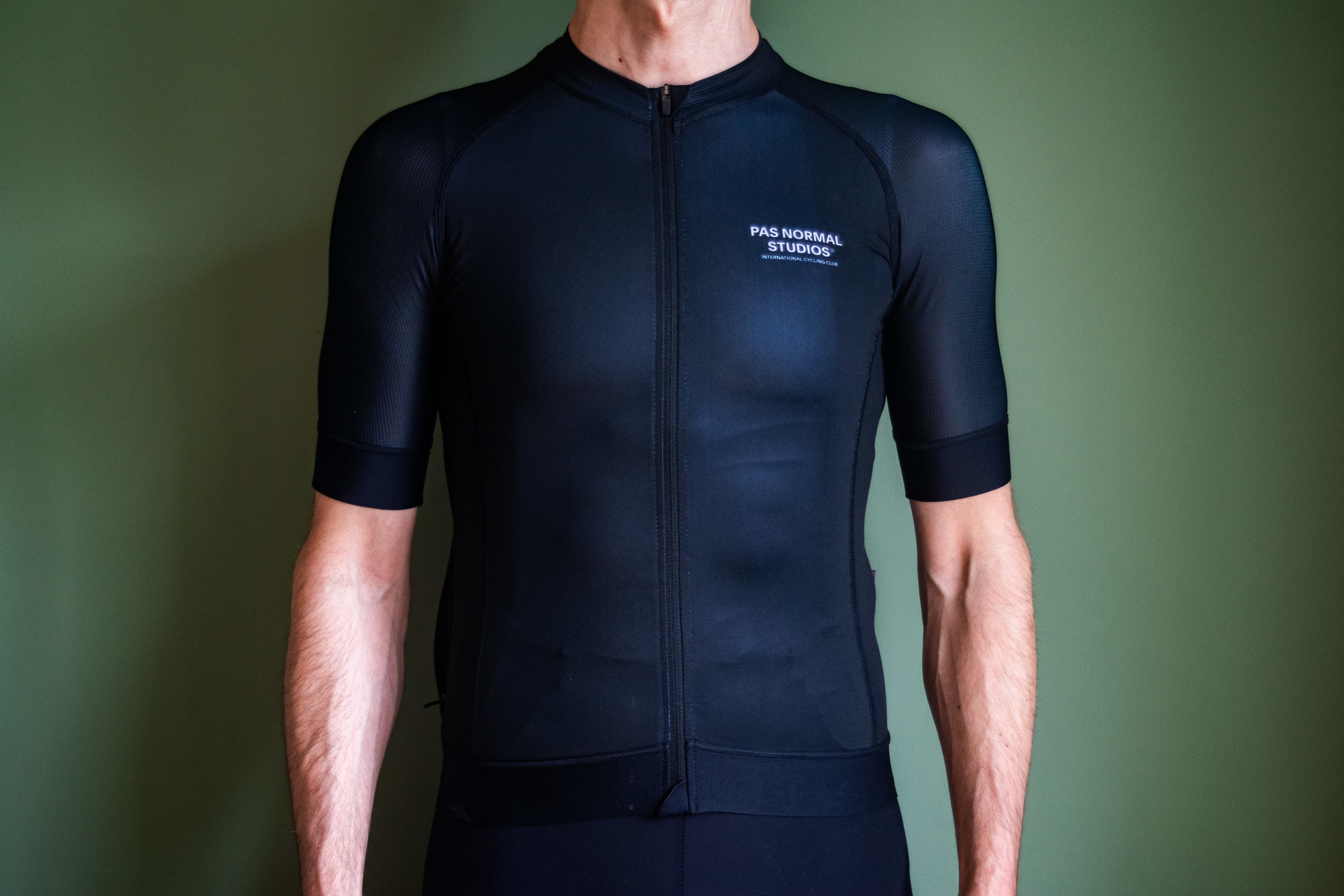 A man wearing a black PNS Mechanism jersey