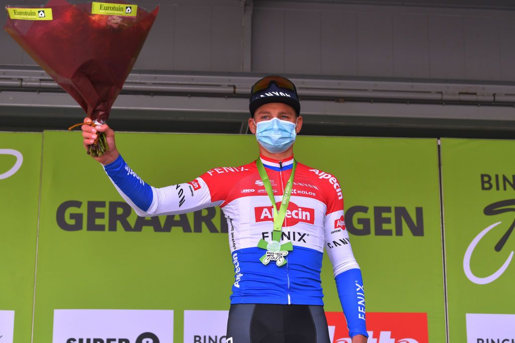GERAARDSBERGEN BELGIUM OCTOBER 03 Podium Mathieu Van Der Poel of The Netherlands and Team AlpecinFenix Celebration Medal Flowers Mask Covid safety measures during the 16th BinckBank Tour 2020 Stage 5 a 1836km stage from Ottignies Louvain la Neuve to Muur van Geraardsbergen 108m BinckBankTour BinckBankTour on October 03 2020 in Geraardsbergen Belgium Photo by Luc ClaessenGetty Images