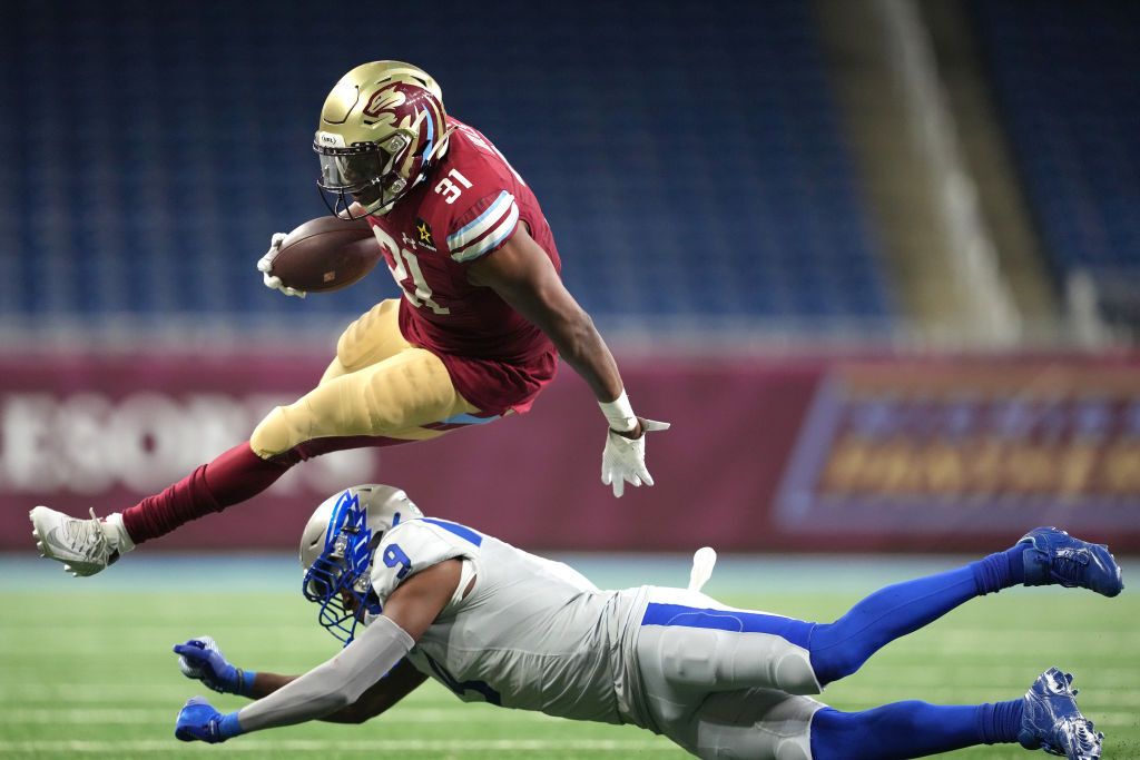 Wes Hills #31 of the Michigan Panthers leaps over Chris Payton-Jones #9 of the St. Louis Battlehawks during the fourth quarter at Ford Field on March 30, 2024