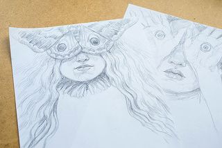 Two pencil sketches showing a female face