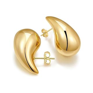 A product image of gold tear drop shaped earrings.
