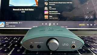 The iFi Uno portable DAC on top of a laptop