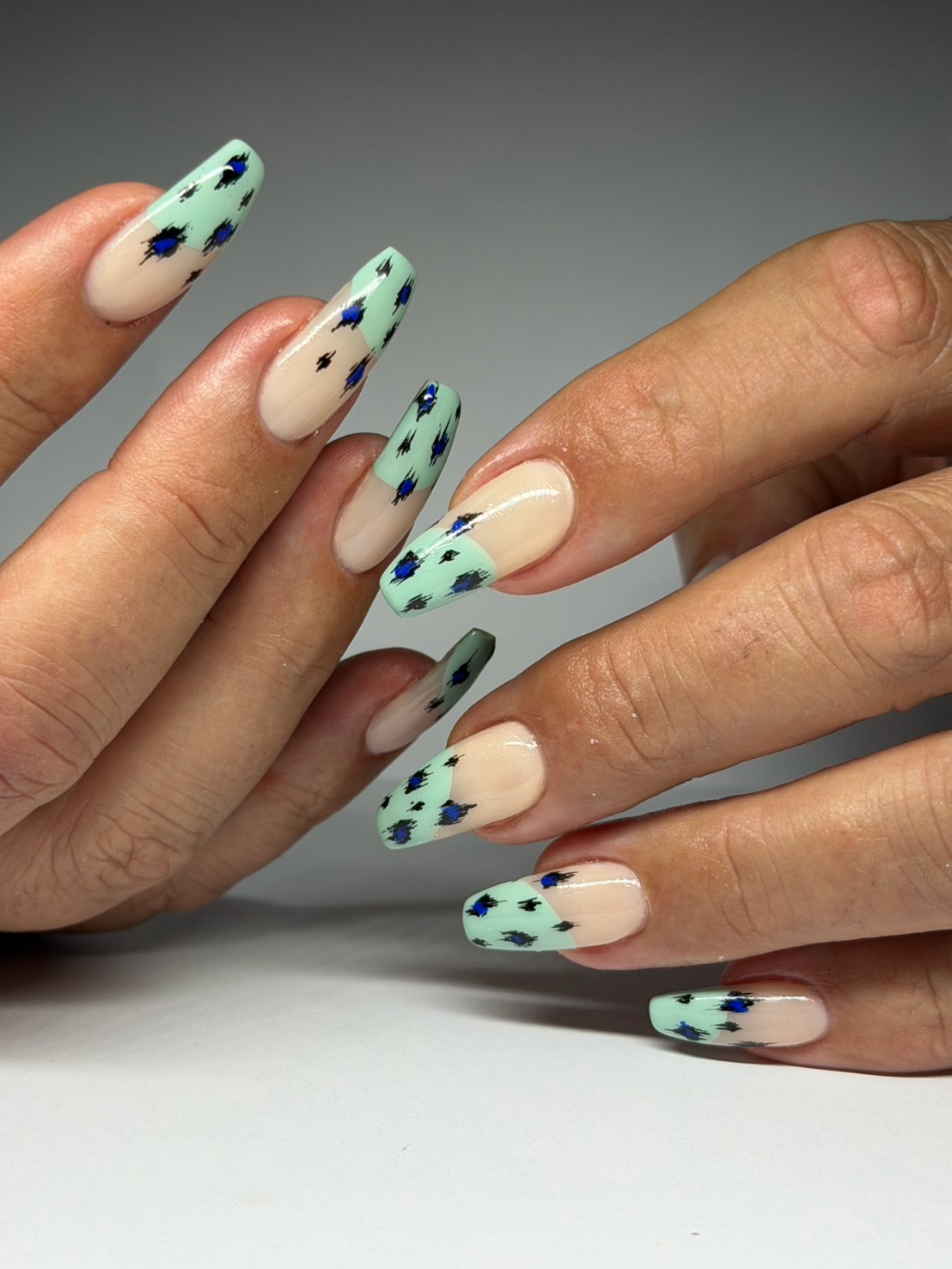 Feather turquoise nails.