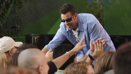 Adam Sandler interacting with fans ahead of an episode of The Tonight Show with Jay Leno in 2008.