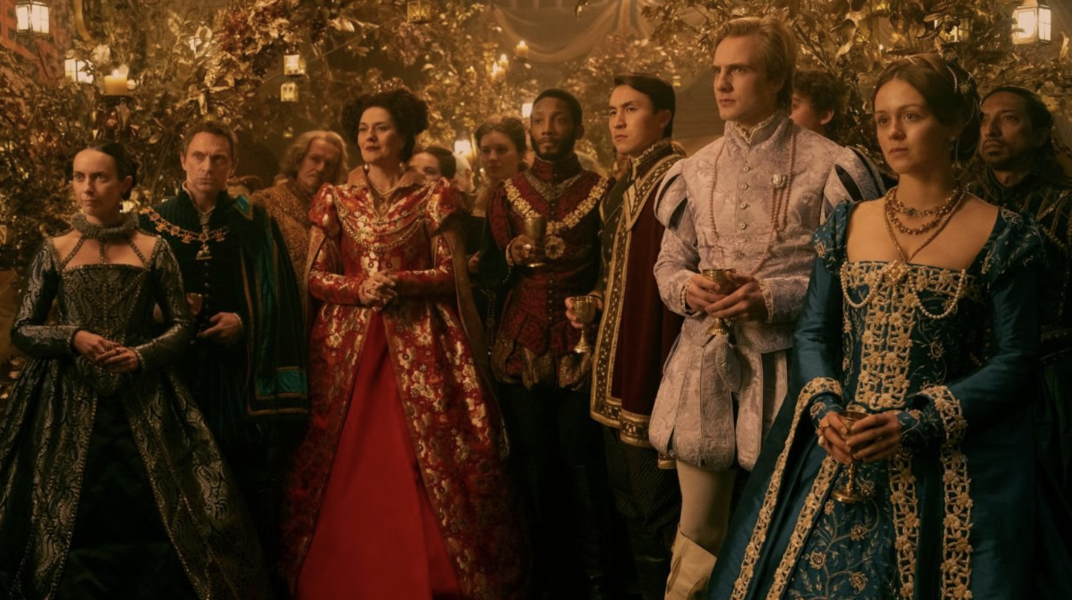 an image from the my lady jane series showing the main cast in the middle of a ball at the tudor court