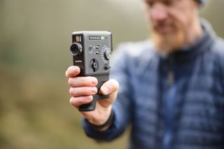 Viltrox AF 85mm F1.4 Pro lens sample gallery: man holding the Fujifilm Instax Mini Evo Cinema camera