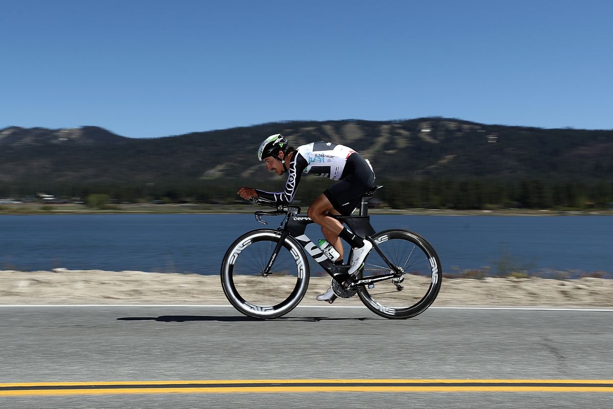Lachlan Morton riding by the shore of Lake Big Bear in the TT