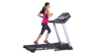 image shows woman running on ProForm Premier 900 Treadmill