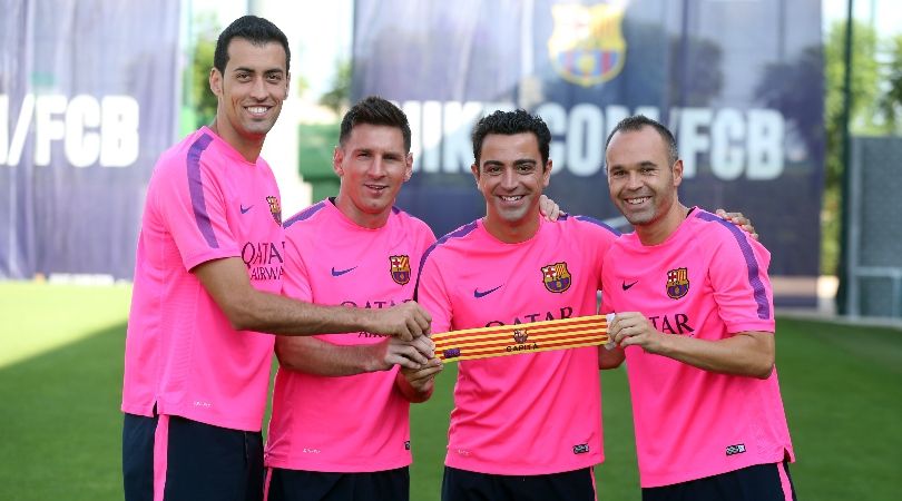 Barcelona captains Sergio Busquets, Lionel Messi, Xavi Hernandez and Andres Iniesta pose at the club&#039;s training ground in August 2014.