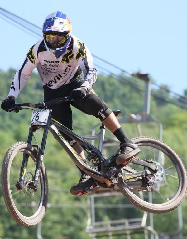 Steve Smith (Devinci Global Racing) gives a tail kick for the crowd at the finish, coming in at 0.958 off the winners pace.