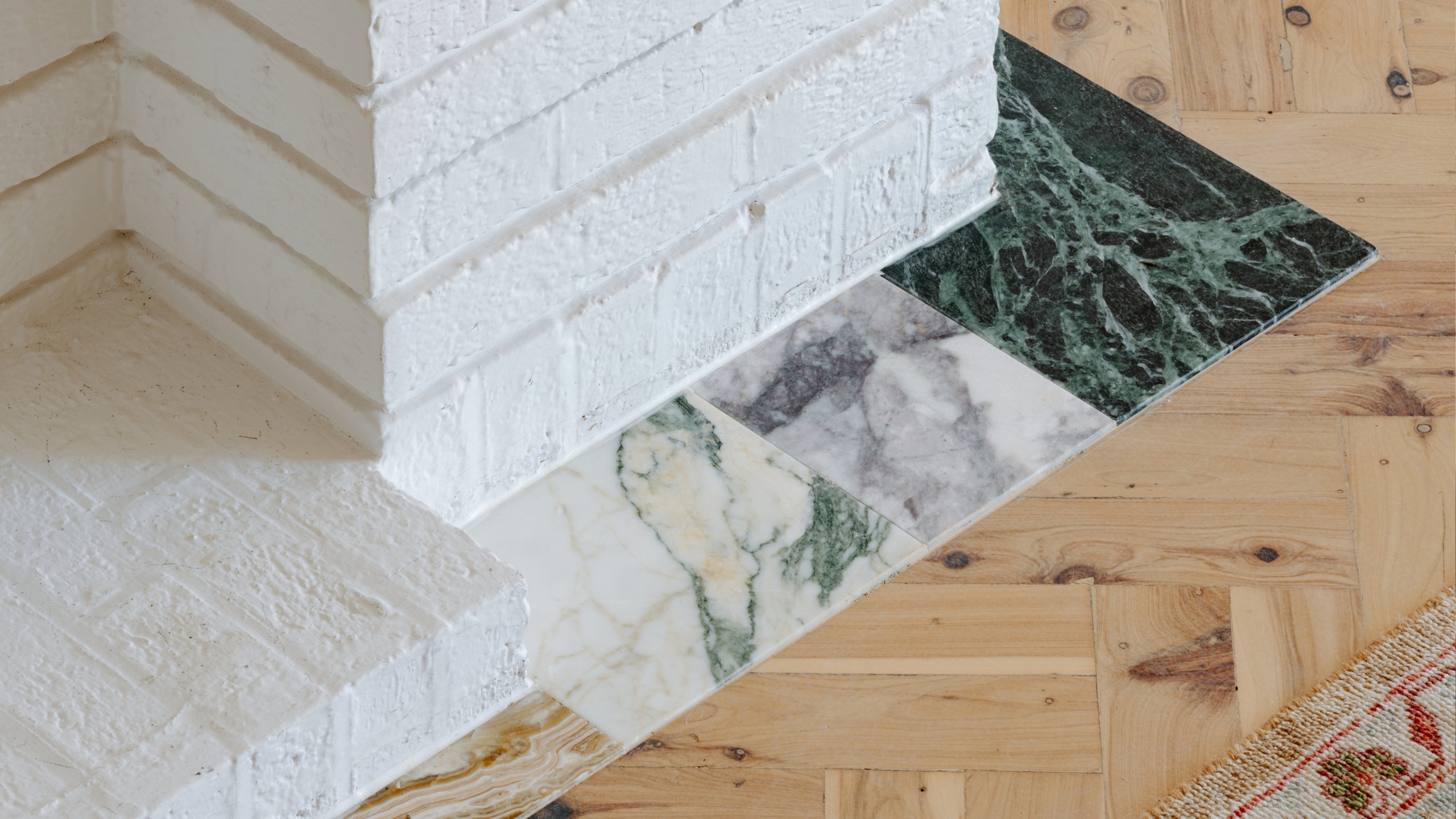 inset marble remnants around a brick fireplace