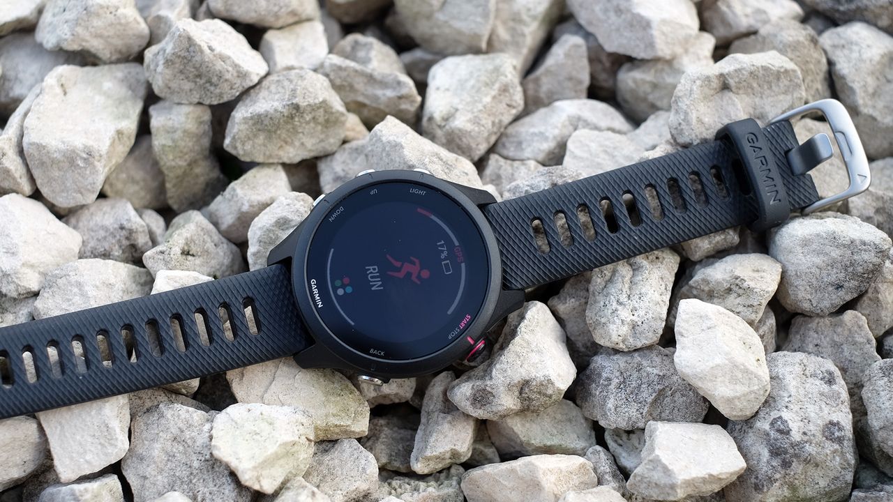 Garmin Forerunner 255 laid down on rocks