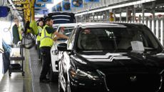 Production line on the factory floor of the Jaguar Land Rover assembly plant in Solihull, England.