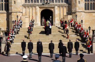 WINDSOR, ENGLAND - APRIL 17: Prince Charles, Prince of Wales, Prince Andrew, Duke of York, Prince Edward, Earl of Wessex, Prince William, Duke of Cambridge, Peter Phillips, Prince Harry, Duke of Sussex, Earl of Snowdon David Armstrong-Jones and Vice-Admiral Sir Timothy Laurence look on as the coffin of Prince Philip, Duke of Edinburgh is carried into St George's Chapel during the funeral of Prince Philip, Duke of Edinburgh on April 17, 2021 in Windsor, England. Prince Philip of Greece and Denmark was born 10 June 1921, in Greece. He served in the British Royal Navy and fought in WWII. He married the then Princess Elizabeth on 20 November 1947 and was created Duke of Edinburgh, Earl of Merioneth, and Baron Greenwich by King VI. He served as Prince Consort to Queen Elizabeth II until his death on April 9 2021, months short of his 100th birthday. His funeral takes place today at Windsor Castle with only 30 guests invited due to Coronavirus pandemic restrictions. (Photo by Pool/Samir Hussein/WireImage)