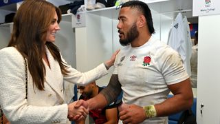 Catherine, Princess of Wales and Patron of the Rugby Football Union congratulates Manu Tuilagi of England on the team's victory in the changing room following the Rugby World Cup France 2023 Quarter Final match between England and Fiji at Stade Velodrome on October 15, 2023 in Marseille, France